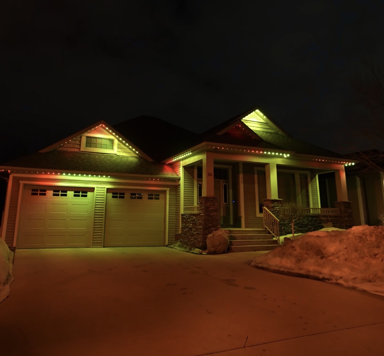 Warm white permanent lighting on modern home